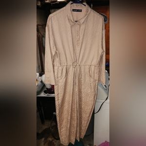 A woman's tan jumper by H&M